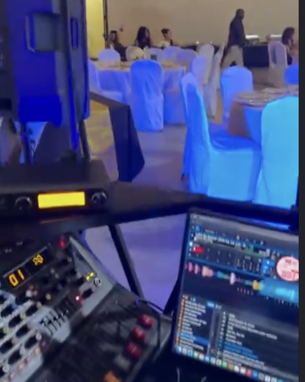 DJ booth at a blue-lit banquet event