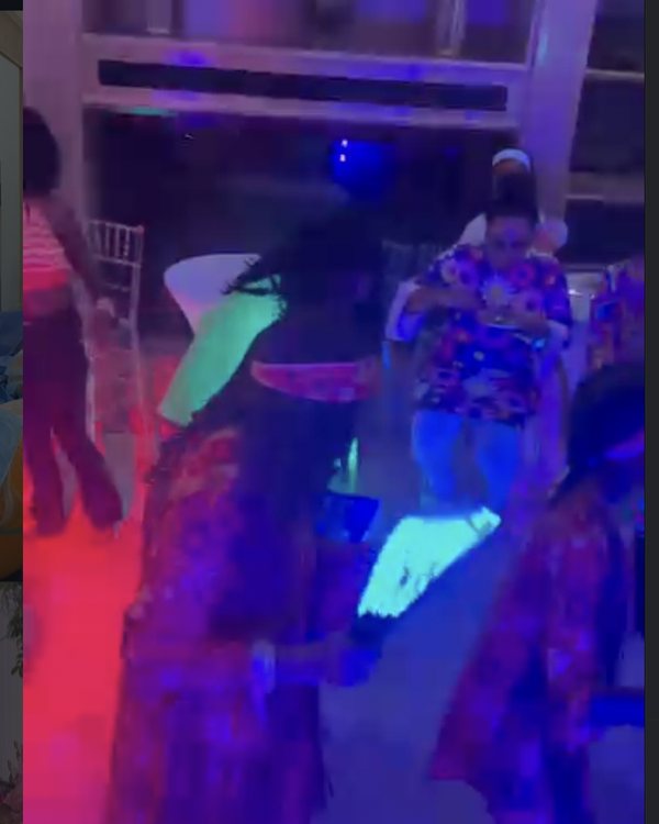 High-energy dance floor with red and blue lighting