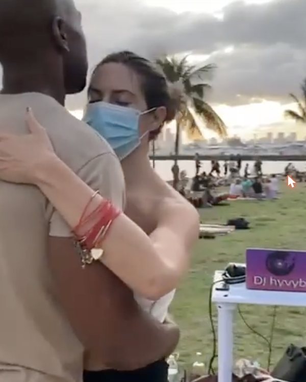 Couple dancing at a sunset event